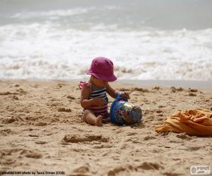Puzzle de Niña jugando en la playa