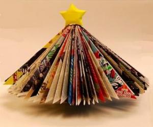 Puzzle de Árbol navideño hecho con hojas de revistas y una estrella amarilla en la punta