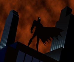 Puzzle de Batman, el hombre murciélago, vigilando la ciudad desde la azotea de un edificio de Gotham City 