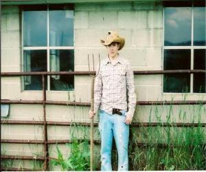 Puzzle de Granjero con la horca en la mano y la granja al fondo