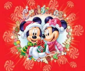 Puzzle de Mickey y Minnie Mouse abrigados con los sombreros de Santa Claus