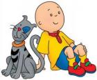 Caillou sentado en el suelo con su gato Gilbert