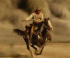 Cowboy o vaquero cabalgando