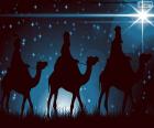 Los Tres Reyes de Oriente en camino sobre sus camellos guiándose por la Estrella de Belén