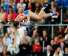 Atleta realizando un salto con pértiga