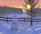 Muñeco de nieve en el paisaje