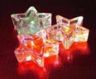 Tres pequeñas velas en forma de estrella