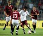 Acción de un partido de futbol en el estadio