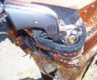 Revólver, enfundado en la cartuchera