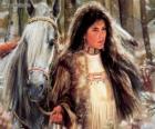 Joven india junto a su caballo