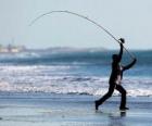 Pescador en la playa