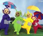 Los cuatro Teletubbies con sus paraguas abiertos