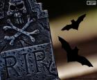 Una lápida con una calavera y las siglas RIP abreviatura de Requiescat in pace y murciélagos volando