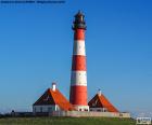 El Westerheversand Lighthouse ubicado en Westerhever, Schleswig-Holstein, Alemania. Uno de los faros más conocidos del norte de Alemania, fue construido en 1908