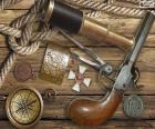 Los objetos básicos de un buen explorador, catalejo, compass, brújula y una pistola
