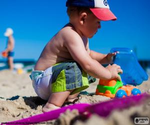 Puzzle de Un niño jugando en la playa